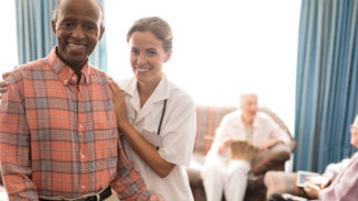 caregiver and elderly smiling