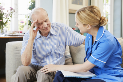 caregiver and senior man doing counseling