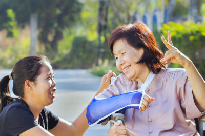 caregiver and senior woman smiling