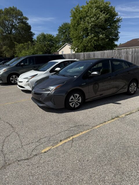 Sedan transportation vehicles parked and ready for service